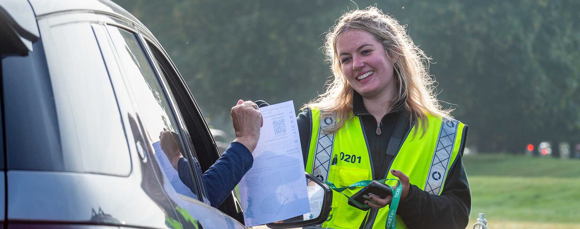 A Tracsis Events Marshal assisting a motorist