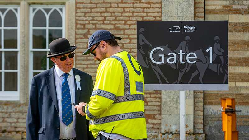 A Tracsis Events Marshal assisting a customer at gate 1
