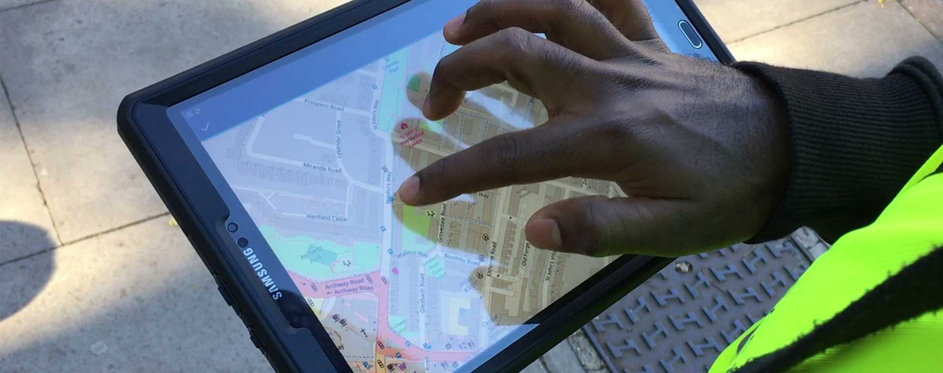 A person using traffic management software on a tablet computer