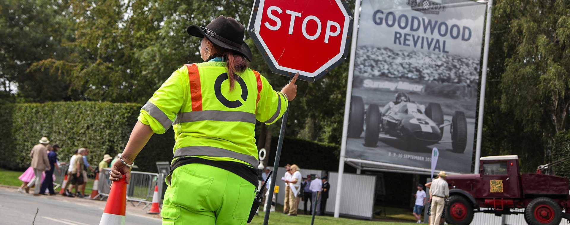 A Tracsis Events Marshal holding a stop sign